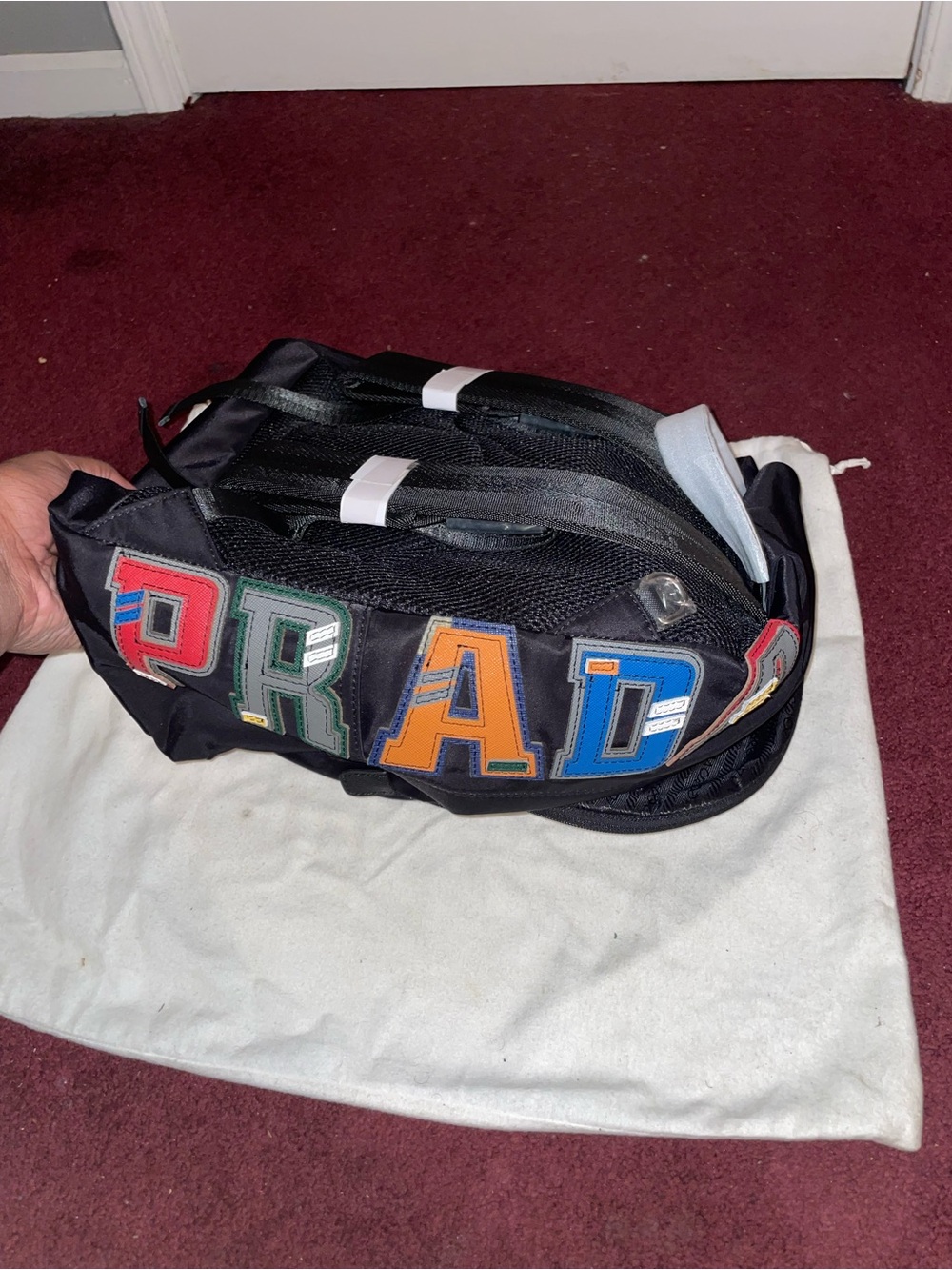 Prada Men’s Black Nylon Backpack with Multicolor Letter Patches